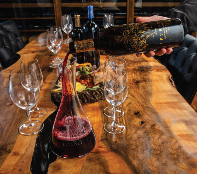 Red wine being poured in to a glass